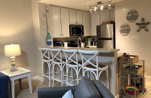 Lower Grand Lagoon Condo | 1st FLOOR UNIT - steps to the beach and pool! Book for the Fall season!