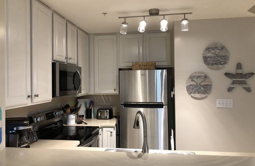 Lower Grand Lagoon Condo | 1st FLOOR UNIT - steps to the beach and pool! Book for the Fall season!