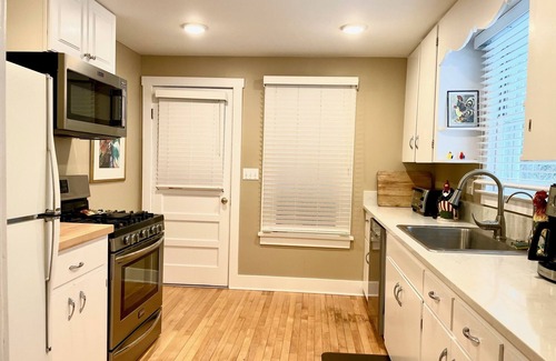 Suttons Bay House | 2/2 CUTE, ANTIQUE FILLED HOME DOWNTOWN SUTTONS BAY!