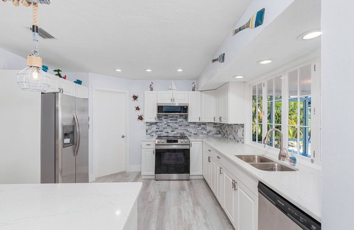 Saint James City House | 2/2 Pool Home on the Water, Boat Lift Included!