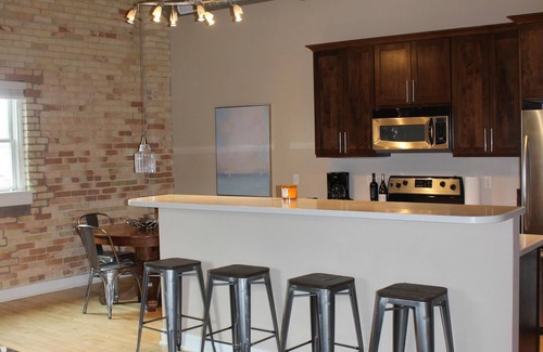 Grand Haven Condo | 2 BD/2BA Modern Condo in the Historic Downtown Armory