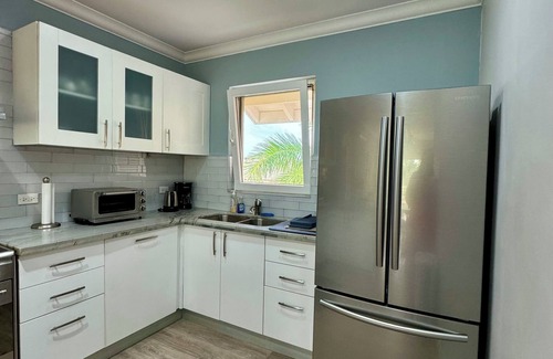 Callendar Condo | 2/Bed Condo, w/AC, Pools, Rooftop patio, 5 Min to Beach, in a gated community.
