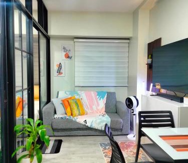 CSJDM Apartment | 2 BEDROOM CONDO close to SM Tungko BULACAN ideal for Family Queen bed on Bedroom 1 accessible to Bedroom 2 with sliding doors Free Wifi & Netflix to watch in a comfy sofa & twin bed Access to SWIMMING POOL entry is very affordable and kids get for free