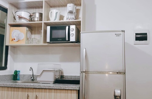 Imus Condo | 2-Bedroom Condo w/Unli Wifi, Netflix, Prime Video, Apple TV, Game Console, Pool