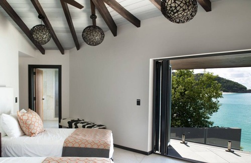 Fryes Beach Villa | 2 bedroom modern villa with stunning views overlooking the beach in Tamarind Hills