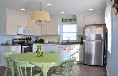 Holden Beach House | 2 bedrooms, 1 bathroom. Pet friendly with a fenced in back yard. Located on canal with dock the perfect place for fishing, crabbing, or docking your boat.