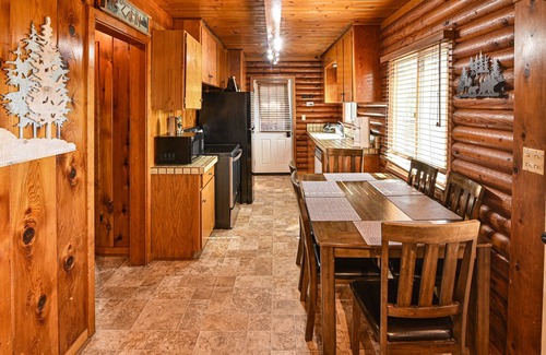 Bass Lake Cabin | 2 BR log cabin with lake view, wrap-around deck, Ping-Pong & wood stove