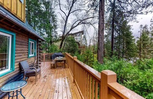 Bass Lake Cabin | 2 BR log cabin with lake view, wrap-around deck, Ping-Pong & wood stove