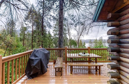 Bass Lake Cabin | 2 BR log cabin with lake view, wrap-around deck, Ping-Pong & wood stove