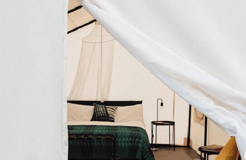 Canoncito RV Rental | 2 Person Glamping tent with one Queen Bed @ Field Trip NM .