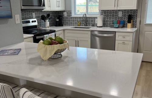 Silver Sands Beach Condo | 2022 Renovation! Surf side and stones throw from the beach!