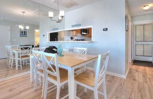 Long Beach Condo | 2BR/2 BA Ocean View Condo in Caswell Beach, Pool, Sleeps 4