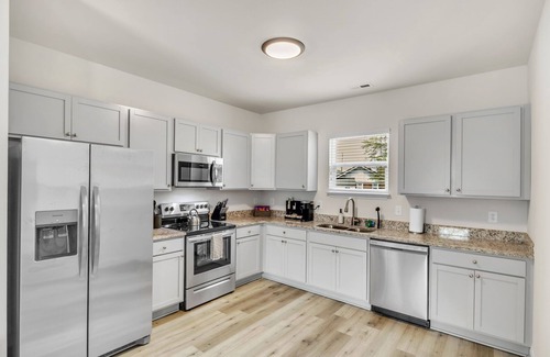 Greer House | 2BR Greer Condo: Pet-Friendly, King Beds, Fire Pit