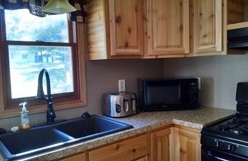 Grayling House | 3 BD, 2 BA Cabin on Big Creek in Lovells, MI