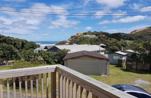 Baylys Beach House | 3-bedroom house overlooking Baylys Beach with WiFi and large garden and deck