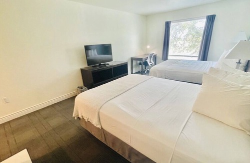 Cuero House | 3 Double Queen With Kitchenette at FairBridge Inn & Suites Cuero, Pet-Friendly!