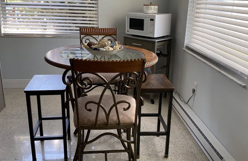 Holmes Beach Apartment | 3 Minute walk to beautiful AMI beach! Old Florida Charm with a Modern Flair!