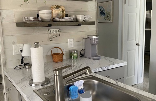 Holmes Beach Apartment | 3 Minute walk to beautiful AMI beach! Old Florida Charm with a Modern Flair!