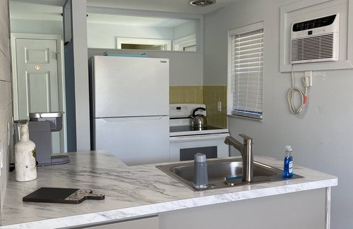 Holmes Beach Apartment | 3 Minute walk to beautiful AMI beach! Old Florida Charm with a Modern Flair!