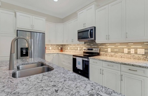 Isles of Collier Preserve Apartment | 30-day minimum lease | Isles of Collier | 3 bedrooms | 3 bathrooms | a den/office | sunroom | 2-car garage.