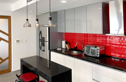 Luis Donaldo Colosio Apartment | 303 Beautiful apart meters away from the sea with a rooftop pool pet friendly!