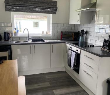 Scurlage House | 37 Gower holiday village Ty Seren Cosy 2 bedroom chalet with a seasonal pool