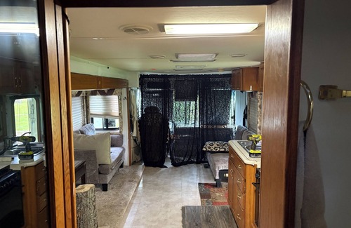 McMillan House | 38 ft Holiday Rambler RV with full hookups electric wifi everything you need.