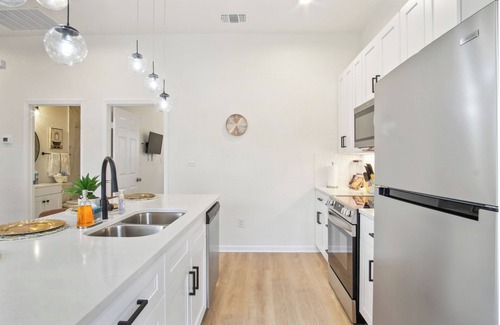 Near East Side Apartment | 3br-2ba Cityscape Haven With Panoramic Tower View!
