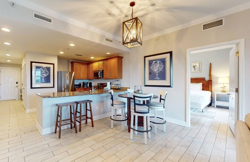 Upper Grand Lagoon Condo | 3rd-floor beach & pool-view condo with outdoor pool, hot tub, grills, balcony