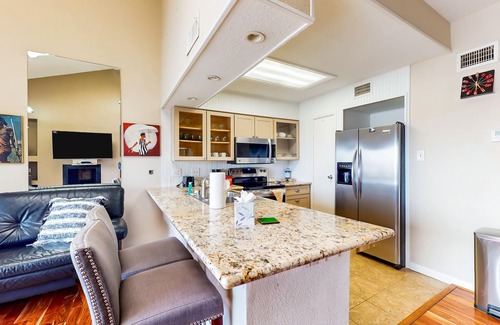 El Lago Condo | 3rd-floor condo with water views, on-site pool, & private balcony