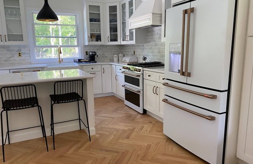 East Marion House | 4-bed 3.5-bath house with fenced heated pool and hot tub, fire pit, kids swings