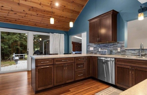 Rapid City Cabin | 4-bedroom Cabin on the Rapid River with WiFi, AC, Dock, Access to Chain of Lakes