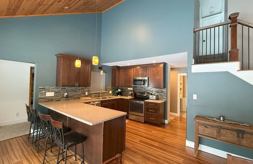 Rapid City Cabin | 4-bedroom Cabin on the Rapid River with WiFi, AC, Dock, Access to Chain of Lakes