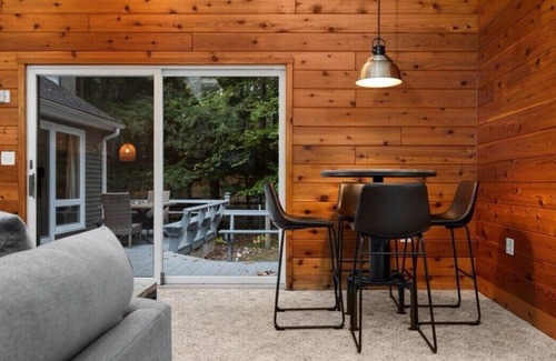 Rapid City Cabin | 4-bedroom Cabin on the Rapid River with WiFi, AC, Dock, Access to Chain of Lakes