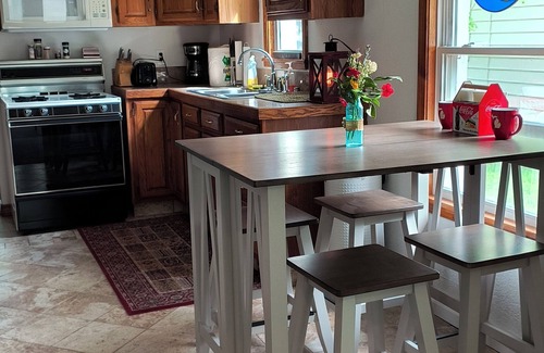 Tawas City House | 4 bedroom home, View and Access to Lake Tawas. Kayaks. Sleeps 9. King Bed.