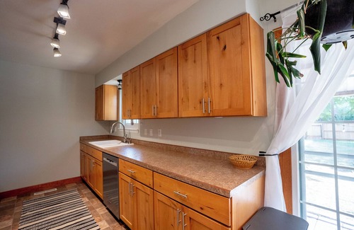 Lander House | 4-Bedroom Home with Fenced Backyard