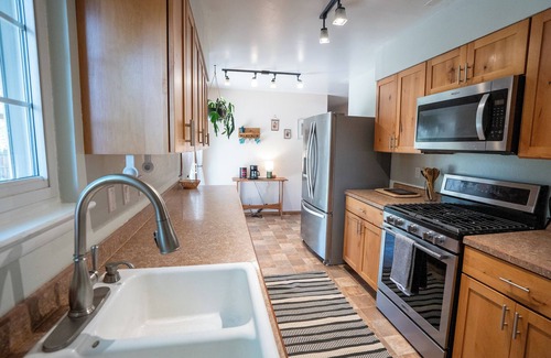 Lander House | 4-Bedroom Home with Fenced Backyard