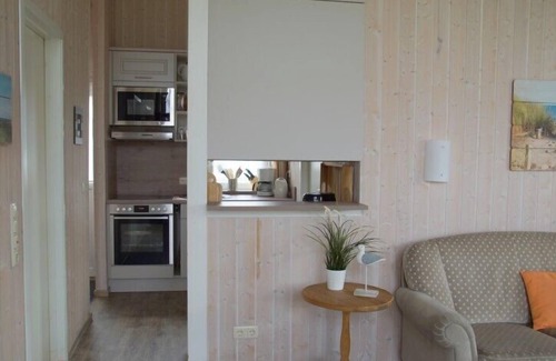 Norderteil House | 4-person fishing vacation home with private jetty, direct lakeside location, canoe and sauna in Otterndorf