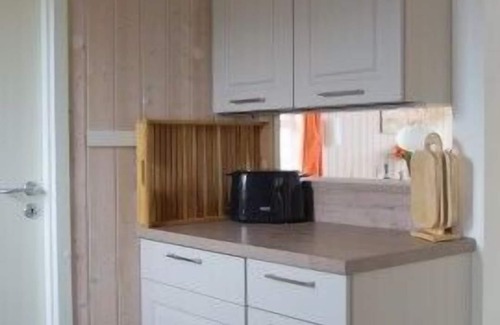 Norderteil House | 4-person fishing vacation home with private jetty, direct lakeside location, canoe and sauna in Otterndorf