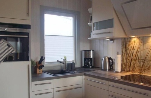 Norderteil House | 4 person luxury holiday home with sauna, wood-burning stove, air conditioning, canoe and lake view in Otterndorf