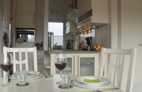 Norderteil House | 4 person luxury holiday home with sauna, wood-burning stove, air conditioning, canoe and lake view in Otterndorf