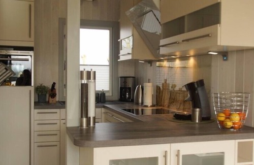 Norderteil House | 4 person luxury holiday home with sauna, wood-burning stove, air conditioning, canoe and lake view in Otterndorf