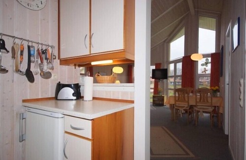 Norderteil House | 4 person vacation home with private jetty, direct lakeside location, canoe and sauna in Otterndorf
