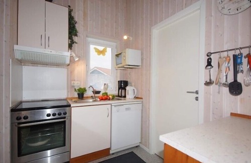 Norderteil House | 4 person vacation home with private jetty, direct lakeside location, canoe and sauna in Otterndorf