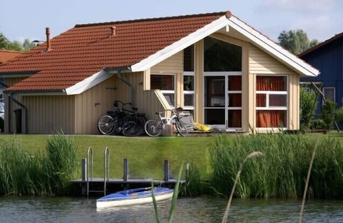 Norderteil House | 4 person vacation home with private jetty, direct lakeside location, canoe and sauna in Otterndorf