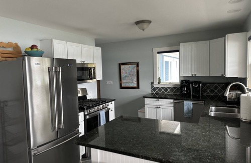 Suttons Bay Cottage | 4BDR/3BTH waterfront home, dock, firepit, sunsets & in the heart of winecountry