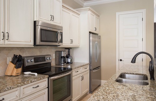 Villa Lago House | 4BR Beach Villa w/2 GOLF CARTS! Near Pool & Wharf. Beach Tram. Covered Patio