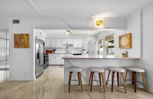 Palm Beach - West Palm Beach House | 4BR centrally located Oasis with Heated Saltwater Pool & backyard for grilling!