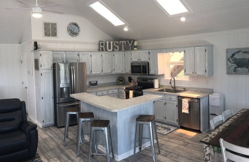 Carova Beach House | 4X4 only! Canal front. Ocean AND sound views! Decks and porches on all levels.