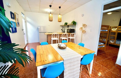 Mayaguez Pueblo Apartment | 5.9 Purple Casita w/historic balcony